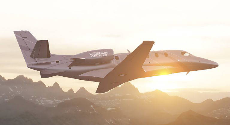 image of an aircraft flying above the mountains, with a low sun poking out behind the aircraft